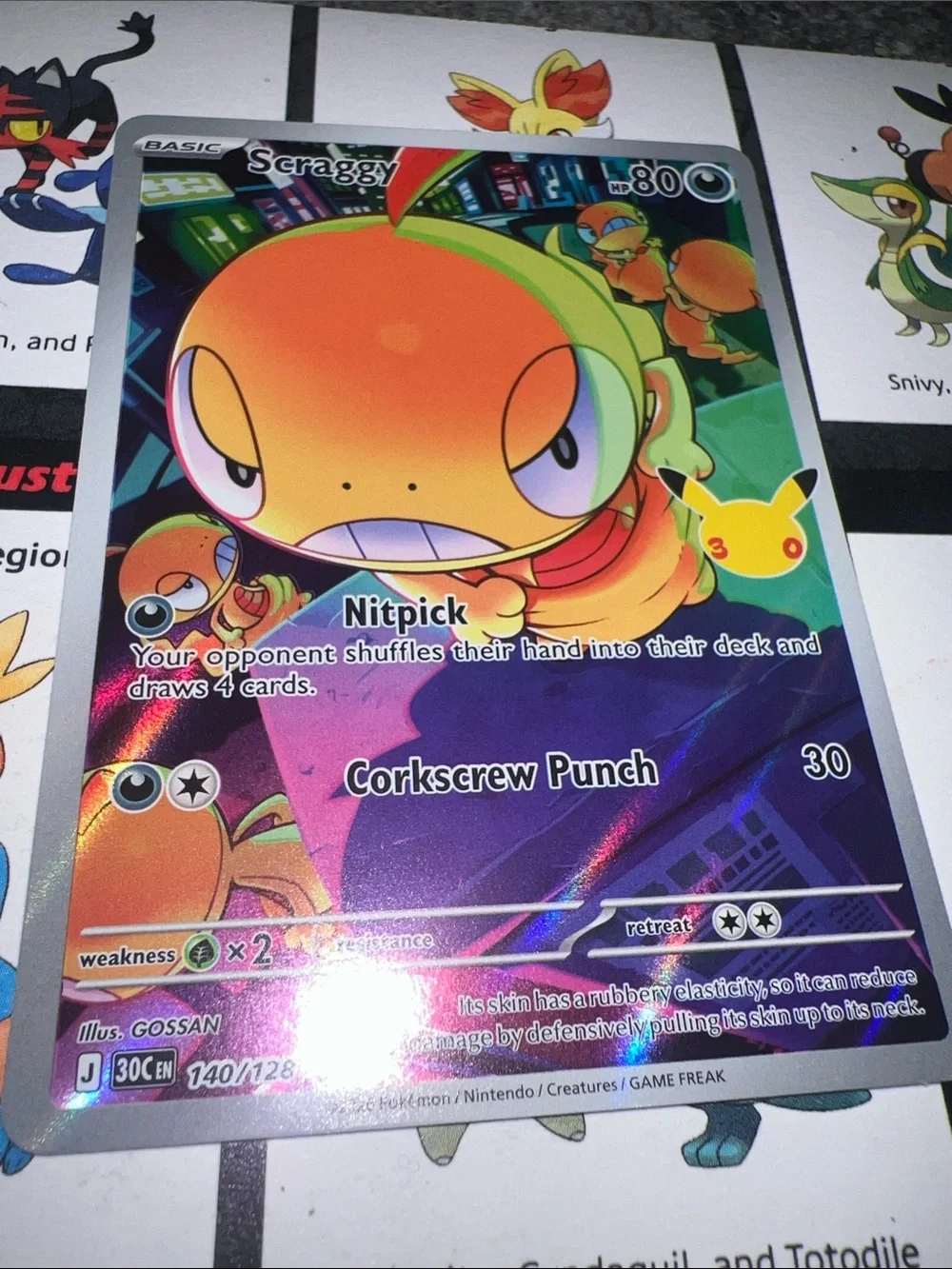 Pokemon Holofoil Scraggy Card - Orange & Green